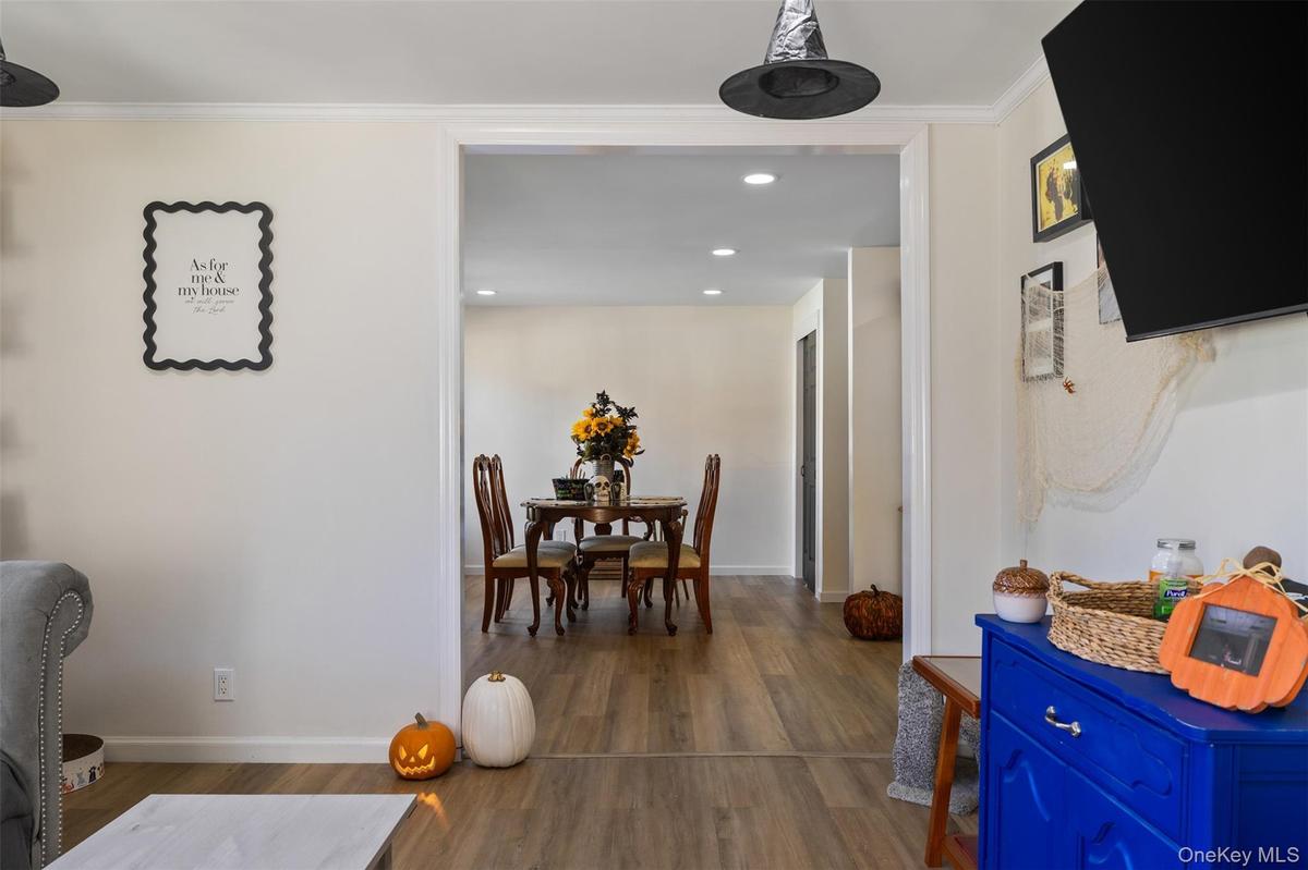 Wide interior archway with wood-finish flooring