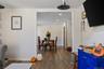 Wide interior archway with wood-finish flooring