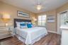 This thoughtfully updated third-floor residence features a smart split-bedroom layout with a generously scaled primary suite and a fully remodeled wal