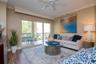 Natural light fills the open living spaces and flows onto an expanded balcony offering morning sun and serene evenings, accessible from the living roo