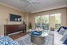 Natural light fills the open living spaces and flows onto an expanded balcony offering morning sun and serene evenings, accessible from the living roo