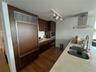 Open kitchen with cooking island with marble top