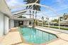 Screened pool and spa area near the dock and canal