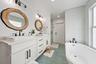 Dual vanity with rectangular vessel sinks, quartz countertops, and matte black fixtures