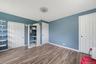 Wood-finish flooring with light blue wall paint