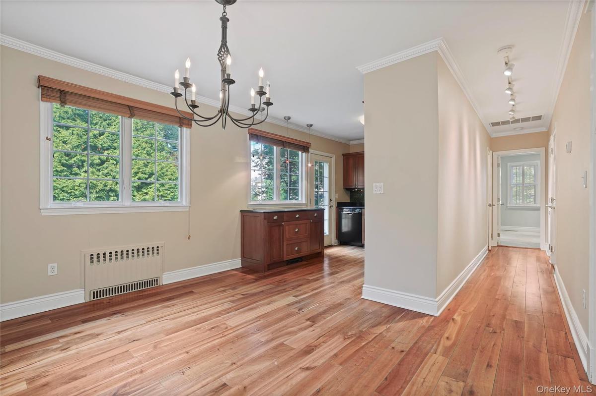 Hallway Leads To First Floor Primary Bedroom With En Suite Bathroom + Powder Room