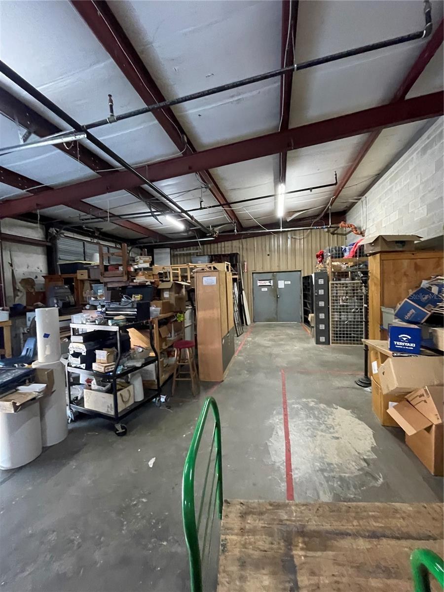 Rear of the sales floor and stock area