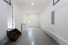 Spacious interior with concrete flooring and recessed lighting