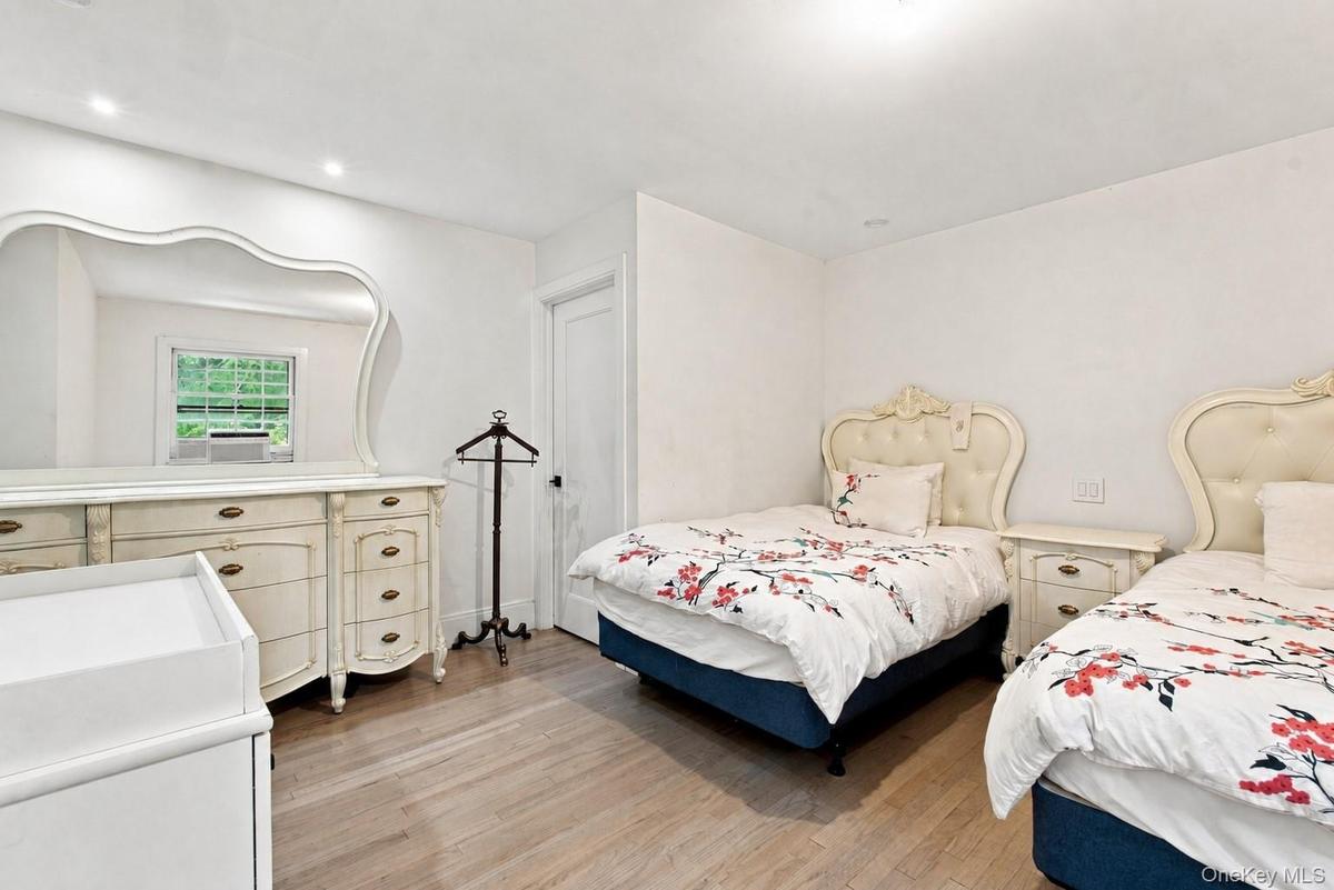 Walking Closet, Recessed lighting, light wood-finish flooring, white walls, and a window with natural light