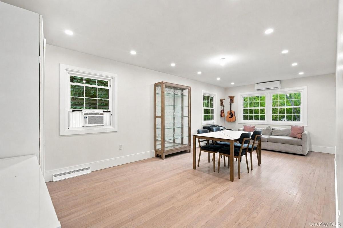 Recessed lighting, wood-finish flooring, multiple windows