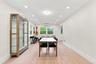 Recessed lighting illuminates the wood-finish flooring