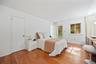 King-sized primary bedroom with large closet, ensuite bathroom, and additional exit to the private patio.
