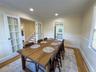 Hardwood flooring, recessed lighting, and crown molding