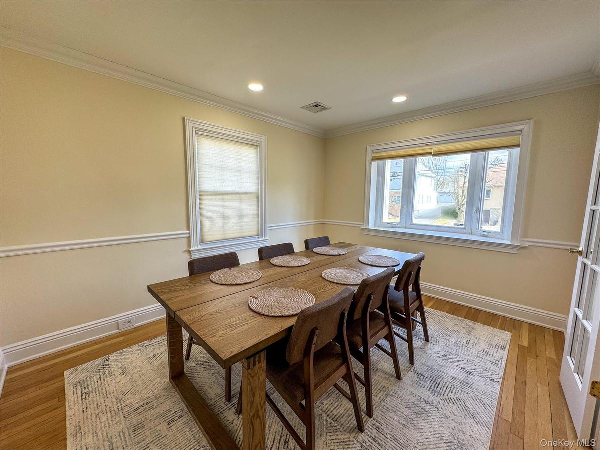 Hardwood flooring throughout, recessed lighting, crown molding, and chair rail detailing