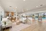 Open concept floor plan with views of the pool and water from anywhere in the Great room, with living room and dining area.