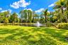 Lake with Fountain and Firepit / Seating Area to enjoy nature and cozy nights outside.