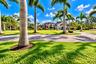 View of Home from Grand Gated Entry...Front of Custom Home 4Bed 4Bath plus Loft with a 3Car Garage