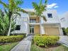 BEAUTIFUL FRONTAL PHOTO OF MODERN 60 DORAL HOME