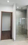 PRIMARY ENSUITE BATHROOM SHOWER W/HER WALK-IN CLOSET