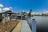 Waterfront property with private dock, paver patio, and covered gazebo