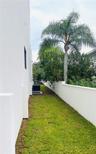 SOUTH SIDE WITH SURROUNDING WALL