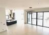 GREAT ROOM VIEW INTO KITCHEN AND DINING AREA