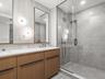 Primary bathroom with contemporary finishes and glass shower