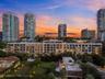 2200 Brickell at sunset with the Brickell skyline beyond - virtual twilight