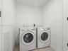 Dedicated laundry room with full-size washer and dryer