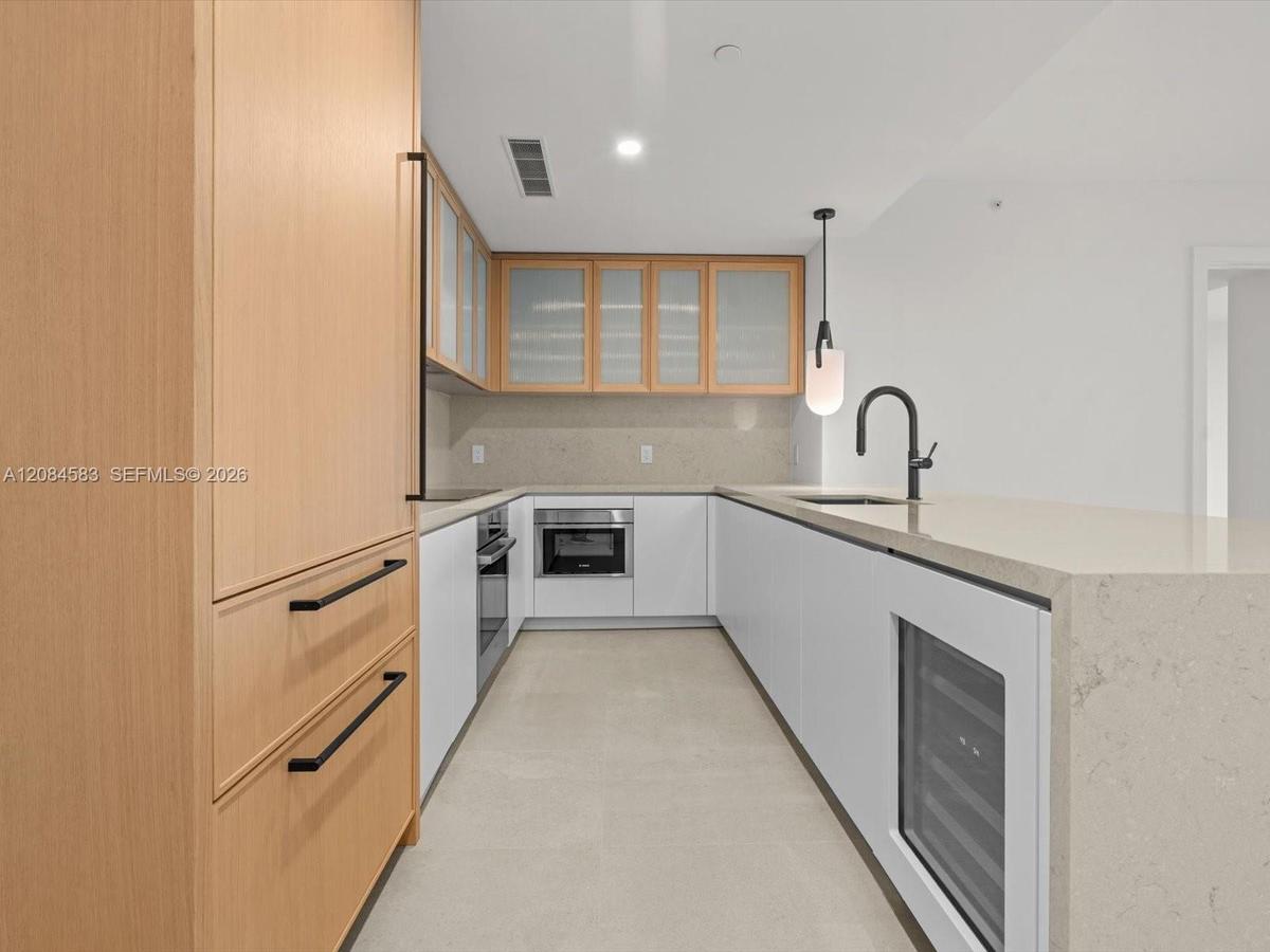 Kitchen island with built in wine cooler