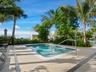 Rooftop spa surrounded by tropical landscaping