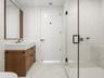 Third full bathroom with glass-enclosed shower