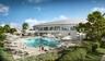 The Cove, a premier 15,000-square-foot facility. Highlights include elite fitness & Pilates studios, rejuvenating spa services, and seamless indoor-ou