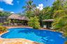 Pool deck, and tiki hut.