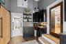 Step-down pantry area, w counters, and storage.