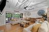 Living room, with open beam ceiling.