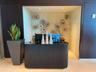 Contemporary reception desk with ribbed detailing and a polished countertop