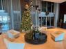Spacious reception area with polished stone flooring and a contemporary chandelier