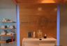 Fitness center reception area featuring a wood-panel accent wall with dimensional signage