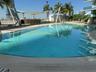 Expansive outdoor pool with integrated sun shelf