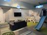 Dedicated play area featuring patterned wallpaper and recessed lighting