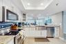 STATE-OF-THE-ART KITCHEN FEATURING STAINLESS STEEL APPLIANCES AND DOUBLE OVEN