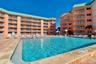 HEATED POOL ON THE SECOND FLOOR POOL DECK, ONE OF THE MANY UNIQUE AMENITIES OF THIS MID RISE COMMUNITY.