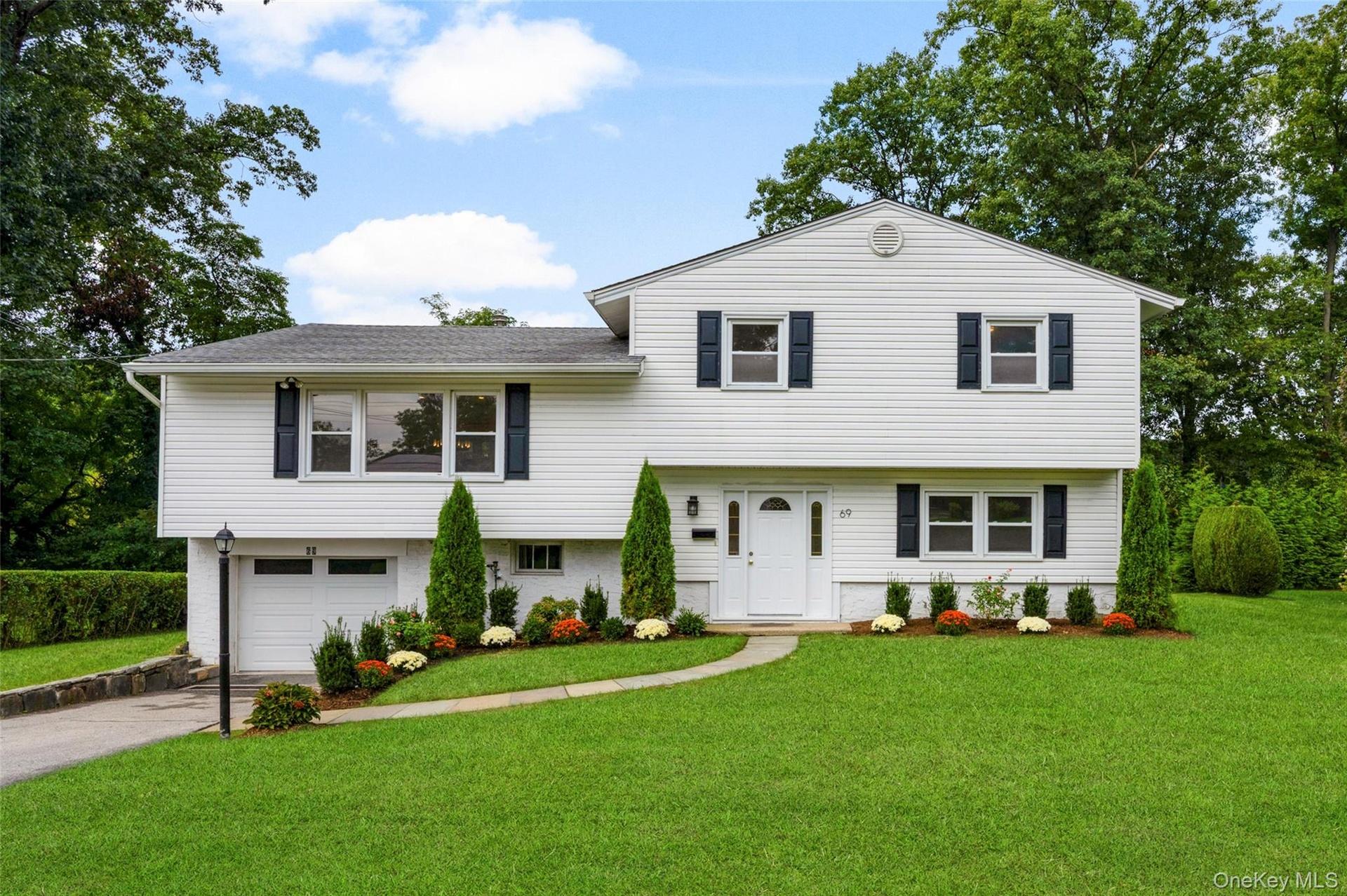Outside, new landscaping and an updated irrigation system create an inviting first impression.
