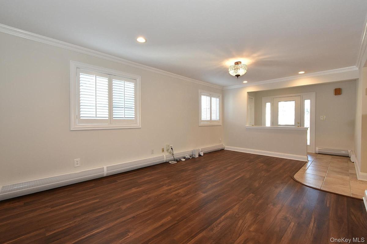Entry Foyer & Living Room with plantation shutters