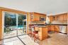 View of kitchen looking into backyard