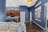 The kitchen and family room connect seamlessly, making it easy to cook, gather, and entertain without anyone feeling tucked away.