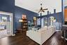 At the heart of the home, the family room offers plenty of space to gather while remaining open to the kitchen.