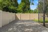 This low-maintenance side area adds another practical outdoor zone alongside the screened pool enclosure.
