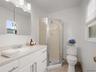 A private en-suite bathroom with stall shower.